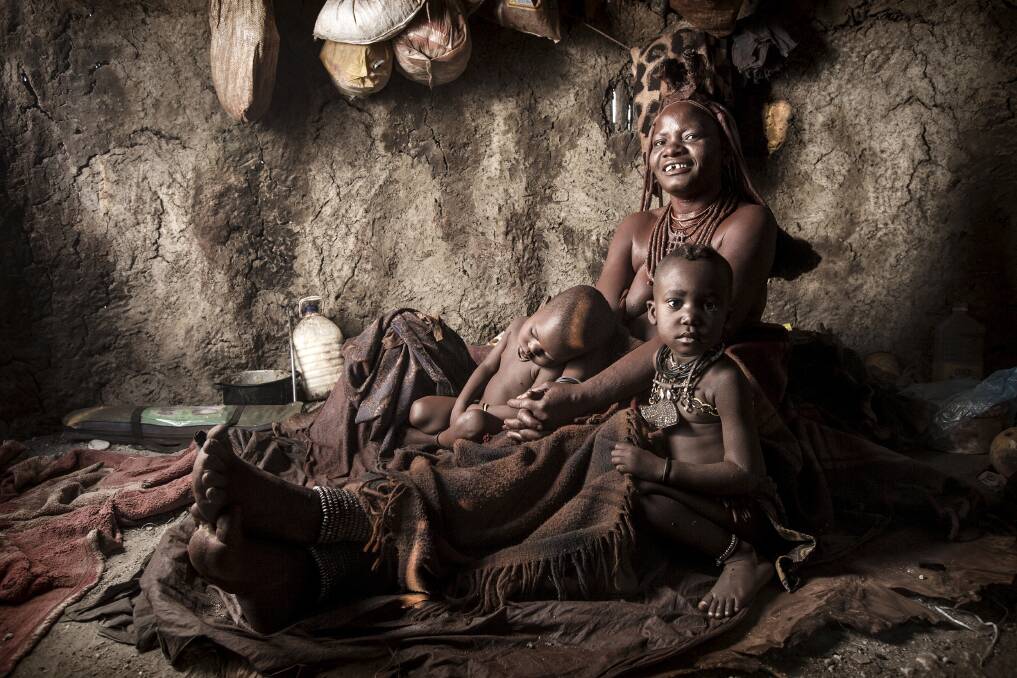 An image of Tjivio, a Himba chief's wife and children, which came second at the #RePicture photo competition. Picture: BEN McRAE