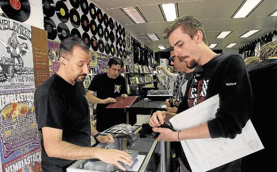 Flat out: Hundreds of people descended on Wollongong store Music Farmers for international Record Store Day, eager to find something new or rare. Record Store Day began in 2007. Picture: GREG TOTMAN