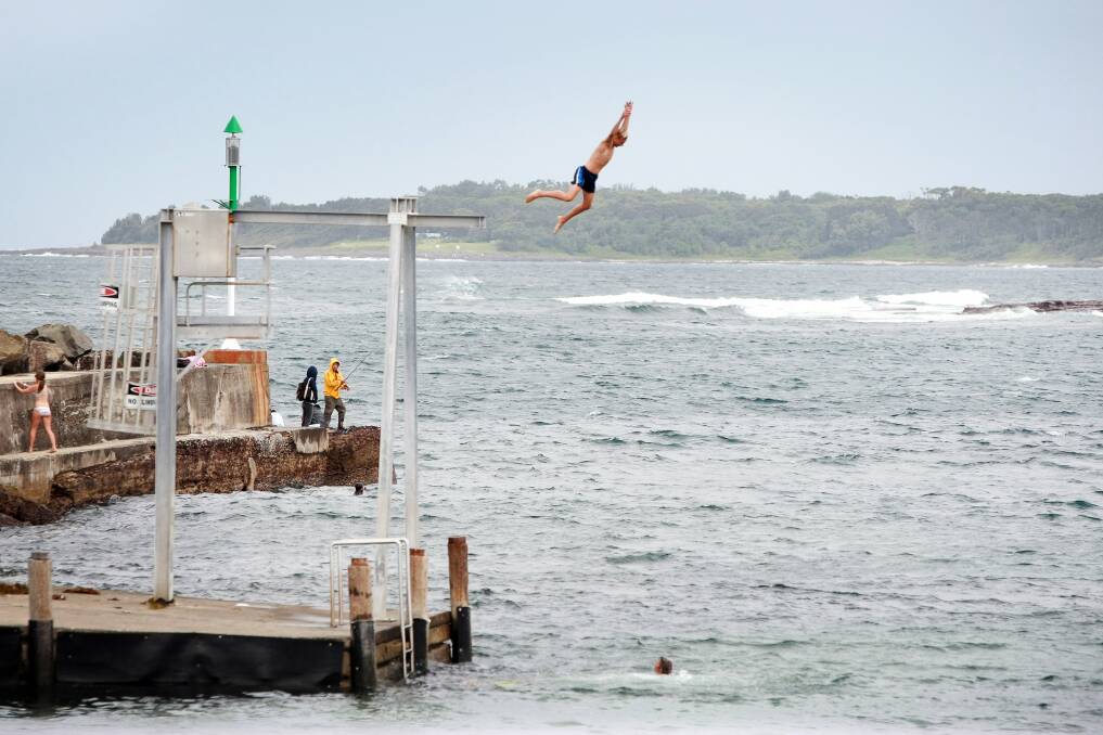 Hazardous leaps from tall waterside cliffs and structures, such as this one at Shellharbour, can prove a danger and more work for safety crews. Picture: SYLVIA LIBER