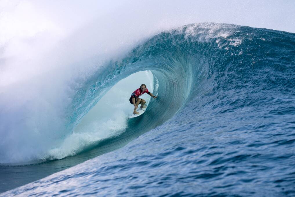 Thirroul's Owen Wright gets frontside in the greenroom during his heat at a gnarly Teahupo'o break. Picture: WILL HAYDEN-SMITH/ASP