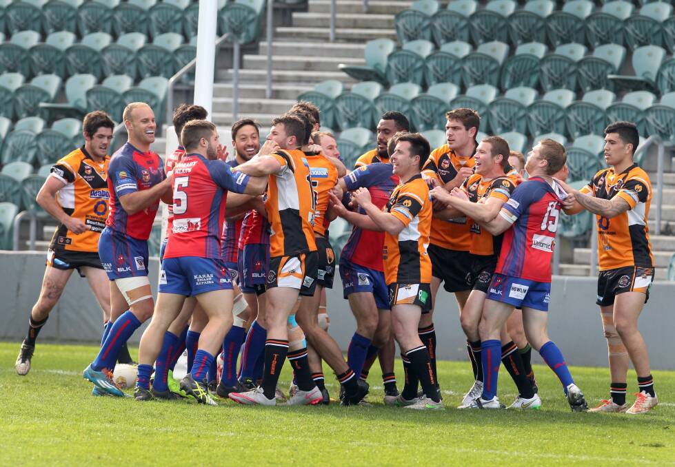 A brawl erupts between Wests and Helensburgh players at WIN Stadium. Picture: ORLANDO CHIODO
