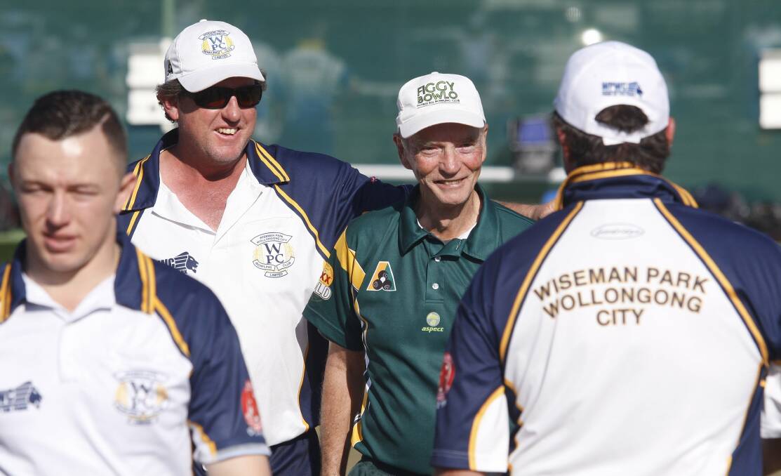 Wiseman Park's Glenn Taylor (back left) congratulates Figgy Bowlo's Harry Johnston (back right) on winning an end during their clash in the Grade 1 semi-final at Warilla Bowling Club. Picture: ANDY ZAKELI