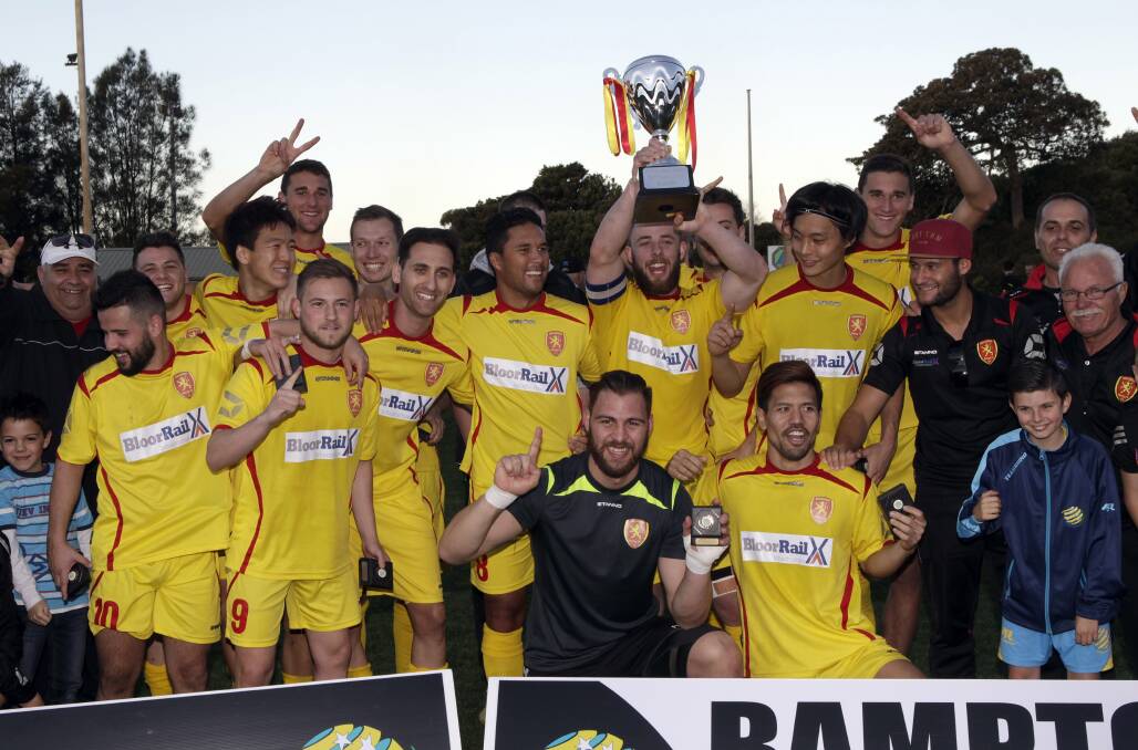 Wollongong United celebrate their Bert Bampton Cup victory. Picture: ANDY ZAKELI