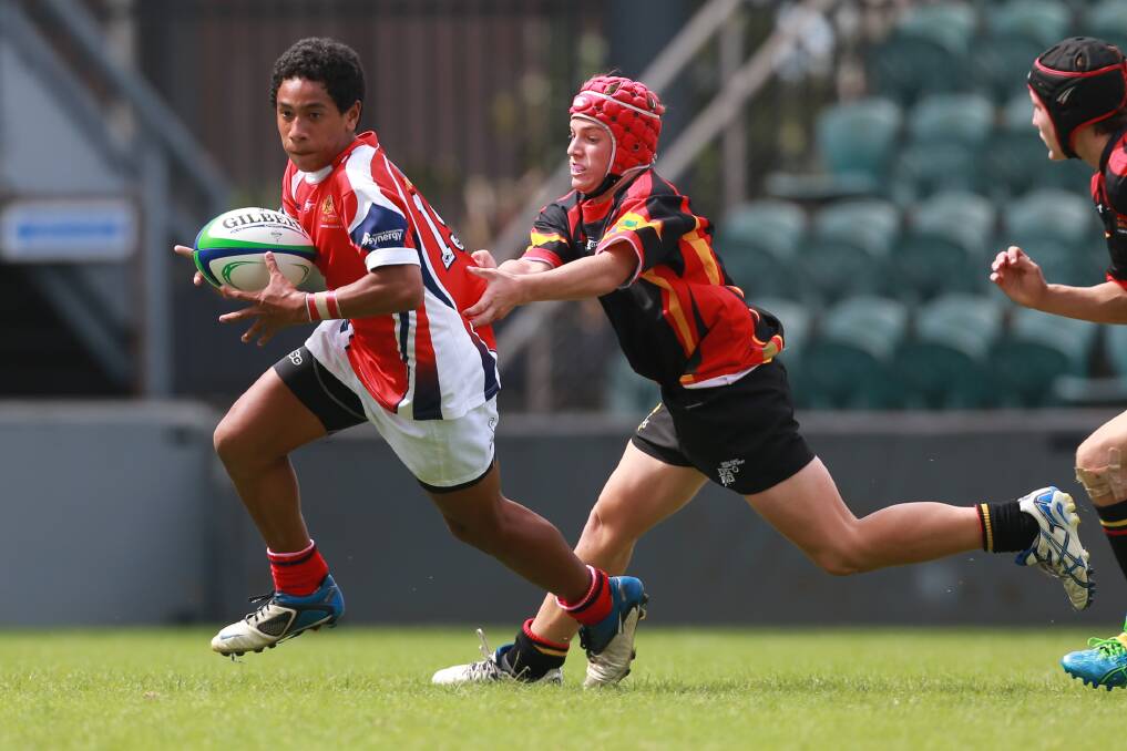 Young talent: A determined Samuela Felemi tries to break the defence for Illawarra during their gritty 24-22 loss to Central Coast in their under-15s National Gold Cup clash at WIN Stadium last Sunday. Picture: CHRISTOPHER CHAN