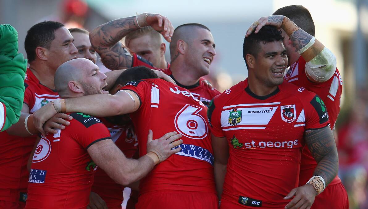 The Dragons celebrate after Benji Marshall scored against the Canberra Raiders at WIN Stadium. Picture: GETTY IMAGES