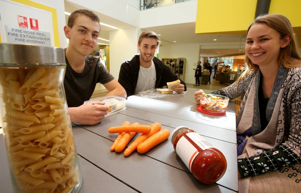 Meagre meal: Rory Watsford, Tom Wilkinson and Jessie Holder with their lunches.Picture: ROBERT PEET