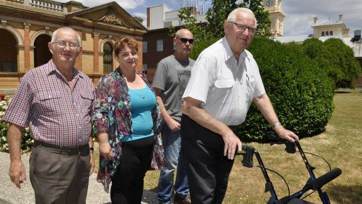 James Hughes' father Colin (right), brother Peter (second right), James's partner, Melissa Pearce and her father, Ron leave Goulburn courthouse on Wednesday, following the inquest's first session. Photo: Goulburn Post
