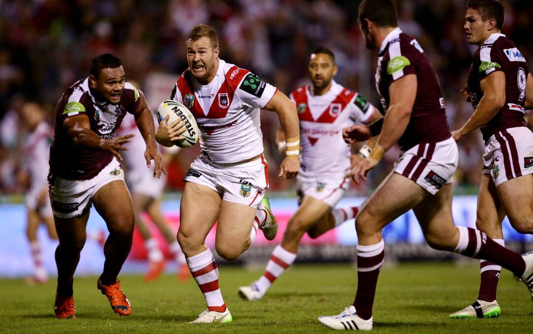 Trent Merrin surges through a gap against Manly at WIN Stadium on Saturday. Picture: GETTY IMAGES