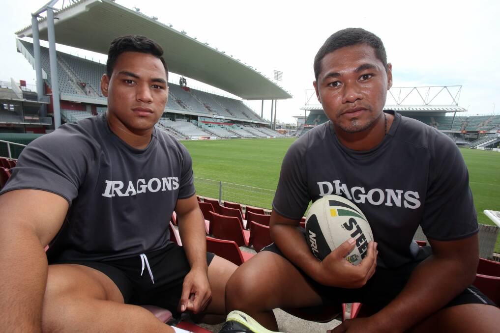 Albert Viali and Gordon Lemisio take a break from a Dragons training session. Picture: ROBERT PEET