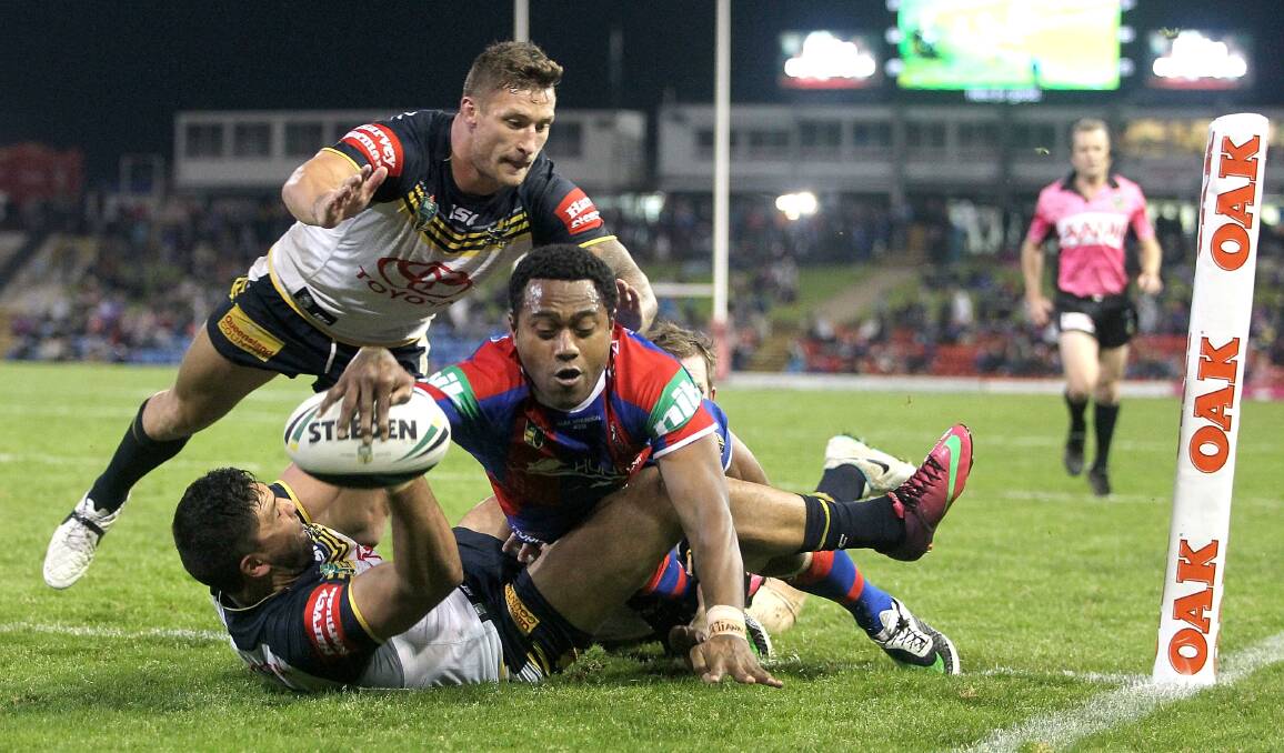 Akuila Uate scores for Newcastle against the North Queensland Cowboys. Picture: GETTY IMAGES