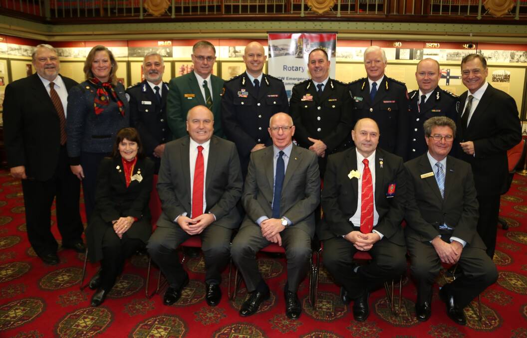 Statewide: Ian and Carole Johnston, back left, Dot Hennessy, NSW Emergency Services minister David Elliot, Governor of NSW David Hurley, front left, with emergency services commissioners. Picture: GREG ELLIS