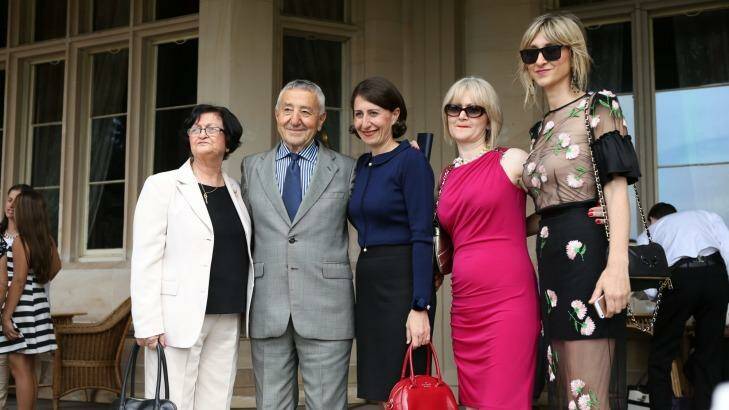Glady Berejiklian with her parents and sisters after being sworn in as the first female Treasurer in NSW. Photo: Louise Kennerley