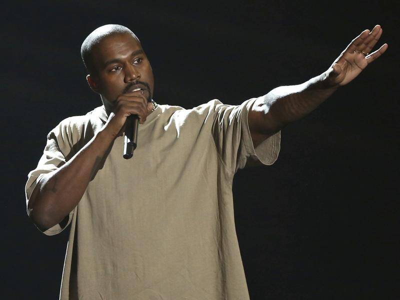 Kanye West has "amicably resolved" a dispute with Lloyd's of London over a cancelled tour.