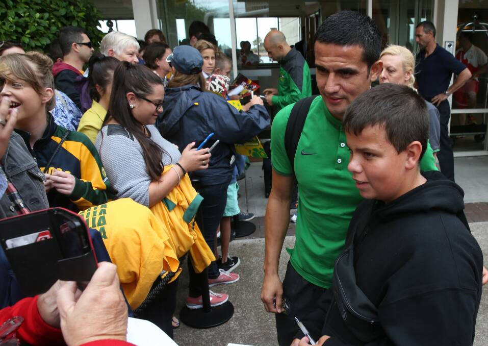 Sydney-bound: The Socceroos meet fans as they leave the Crowne Plaza Hotel in Newcastle en route to the Asian Cup final in Sydney. Picture: MARINA NEIL
