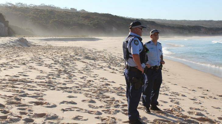 Fatal accident: Police at the scene on Terrace Beach, in Ben Boyd National Park, after a sand dune collapsed on a boy. Photo:  Amanda Stroud