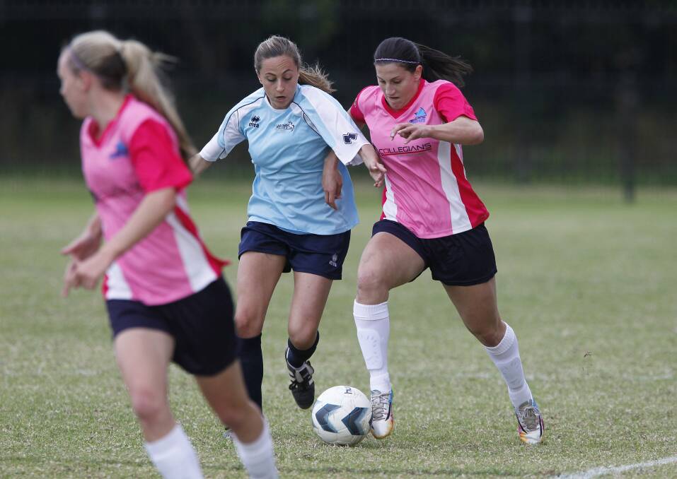 Stingrays' Talitha Kramer (right) shows her strength against Marconi Stallions. Picture: ANDY ZAKELI