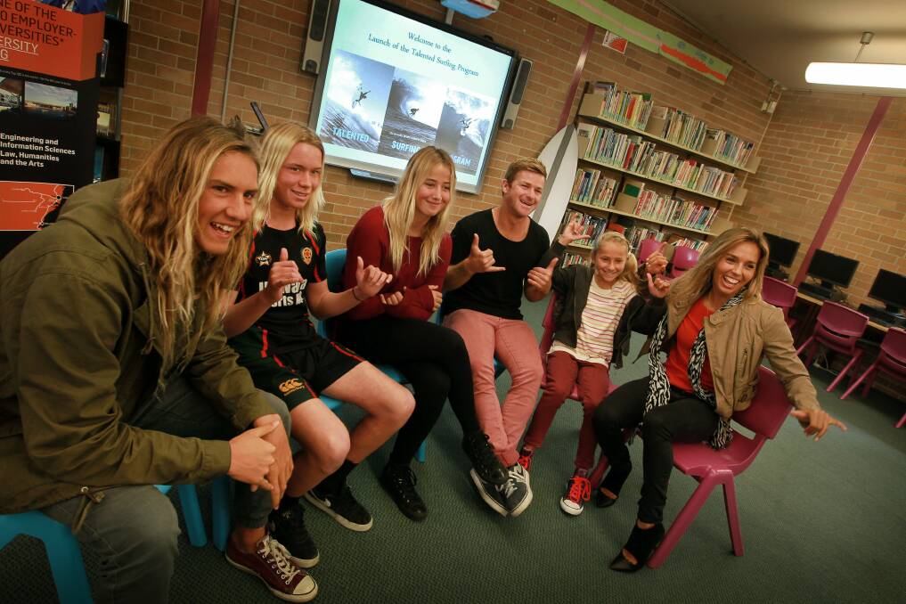 Swell time: World surfing star Sally Fitzgibbons (far right) with Jarrod Szele, Kye Abben, Billie Melinz, Nick Squiers and Charli Hurst at the launch of the Surfing Development Program at Illawarra Sports High. Picture: SYLVIA LIBER
