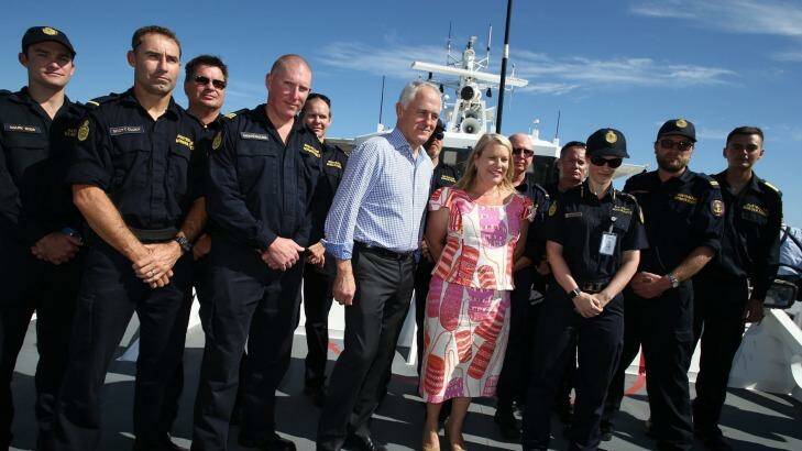 Mr Turnbull with Border Force members and Coalition MP Natasha Griggs. Photo: Andrew Meares