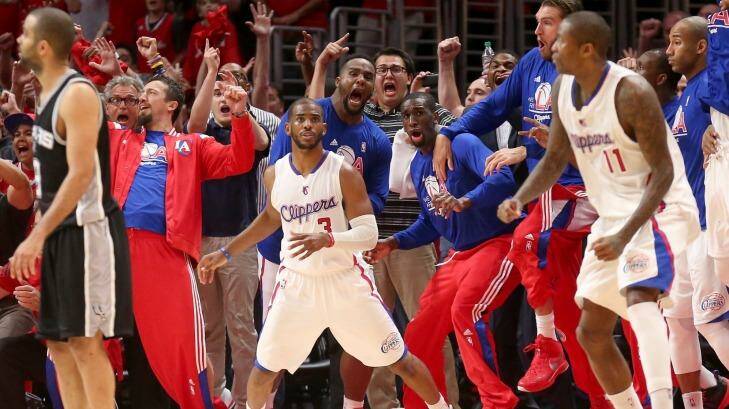 Game winner: Chris Paul and the Clippers bench react after he made a basket with one second remaining to give his team the win against the San Antonio Spurs.  The Clippers won 111-109 to win the series 4-3. Photo: Stephen Dunn