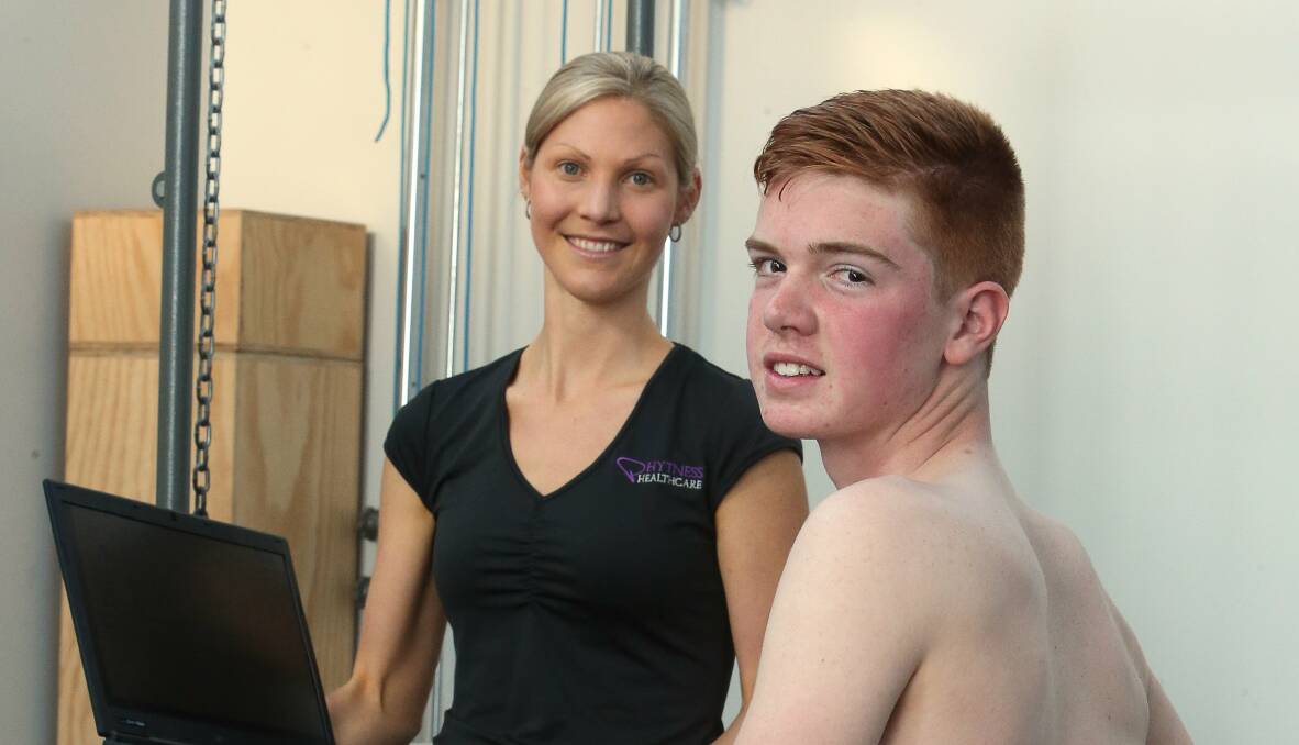 Physiotherapist Tracy Clinch scans Collegians U15s player Charlie Eaton. Picture: ROBERT PEET