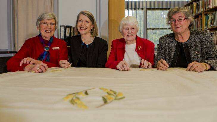 The ACT Embroiders Guild has embroidered a baby blanket that will be given to the new royal baby. From left, Embroider's Audrey Schultz, Lesley Fusinato, Marjorie Gilby, and Jan Hure. Photo: Jamila Toderas