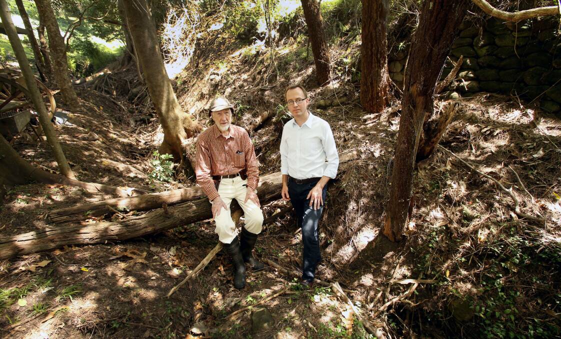 Destructive: Keith Tognetti takes Greens MP David Shoebridge on a tour of the damage done by deer at his Keiraville property. Picture: KIRK GILMOUR