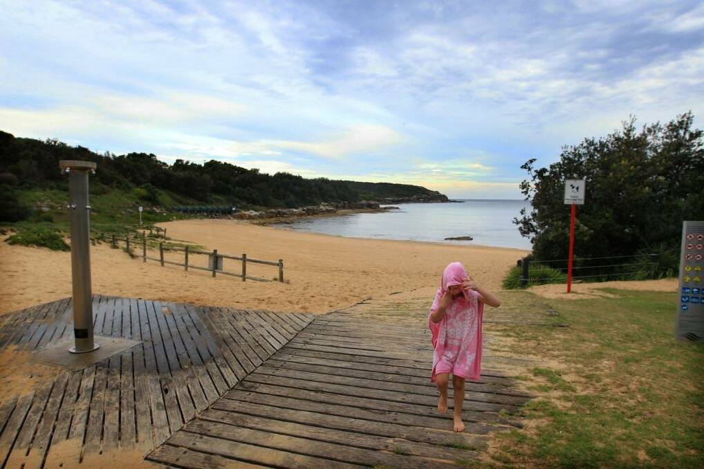 Mercury pumped into the ocean: Children play in the shallows of Malabar Beach. Photo: James Alcock