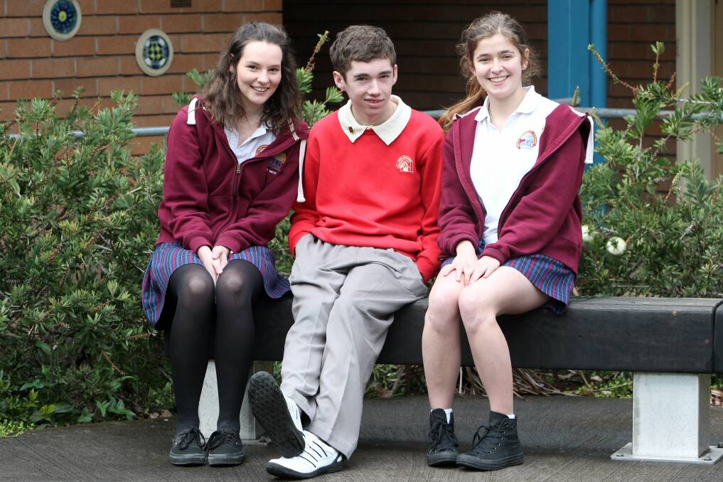 Bulli High students Allira Watts, left, and Grace Donovan with Para Meadows school vice-captain Justin Myer. Picture: GREG TOTMAN