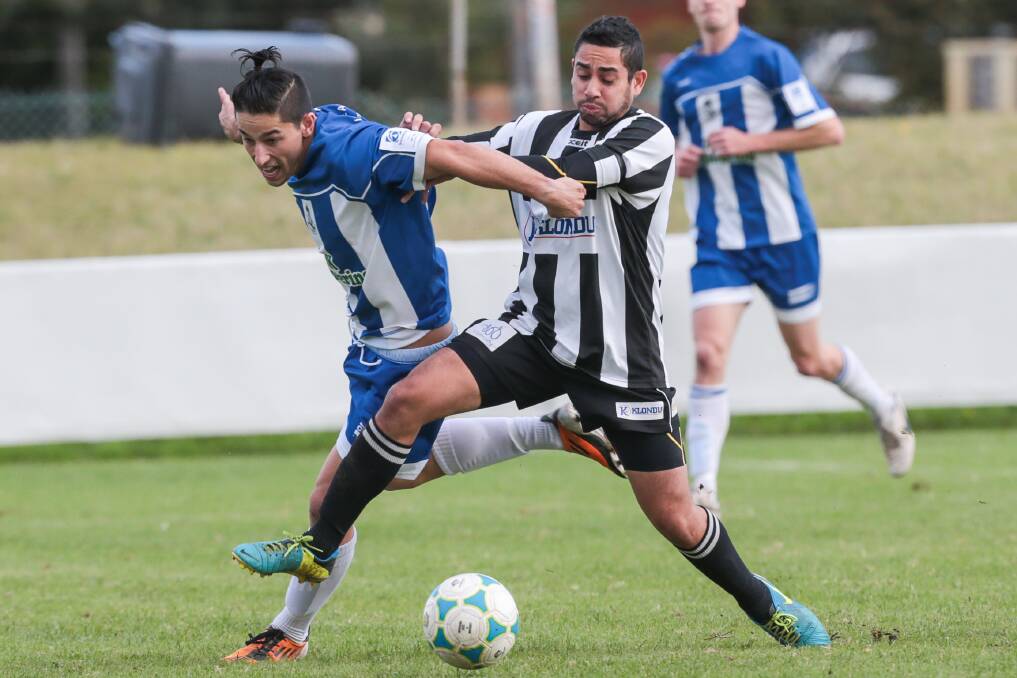 Tarrawanna's Blaise Gassin and Port Kembla's William Mobbs in a close contest. Picture: ADAM McLEAN