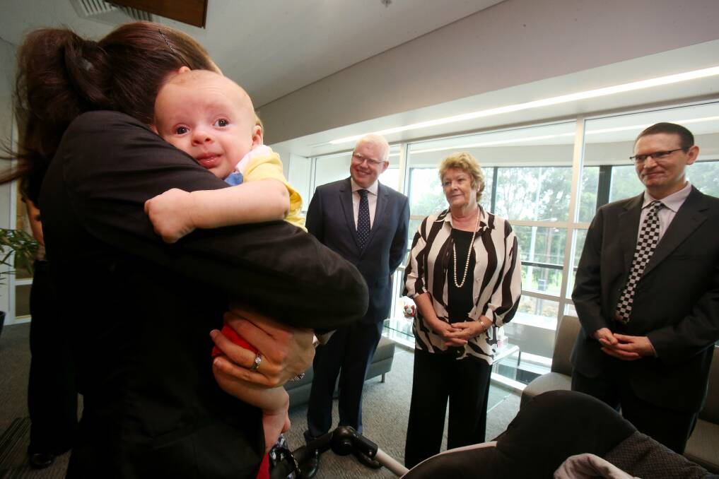 Pilot study: Benji, 10 weeks, with his mother, Brinie Scheen, meets NSW Health Minister Jillian Skinner at UOW. Picture: ROBERT PEET