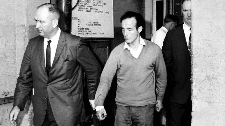 William Macdonald is taken in for questioning by police in May 1963.
 Photo: Bob Rice