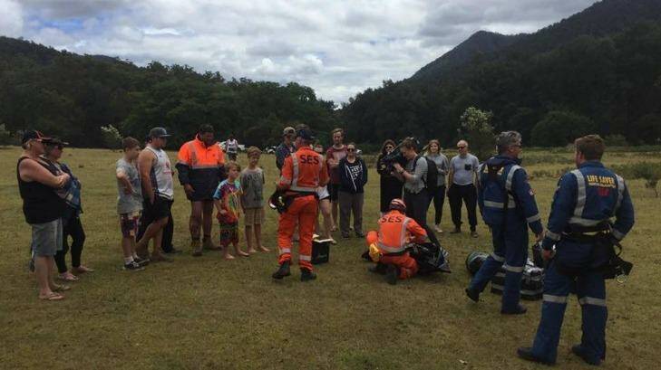 Leah Parker was relieved to see Bodee, in the tie die, Cruz, to his left, and their dad in hi-viz, in photographs from the emergency services. Photo: SES