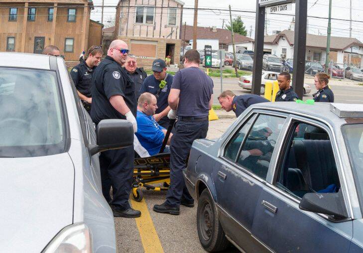 On Thursday afternoon, April 13, 2017, Dayton police and paramedics responded to a report of an unconscious man in the passenger seat of a car parked at a local business on East Third Street, Dayton, Ohio. They administered Narcan, also known as Naloxone, in their effort to revive him. The anti-overdose drug worked quickly and the man was transported from the scene to receive further medical treatment.

 Photo: Steve Bennish