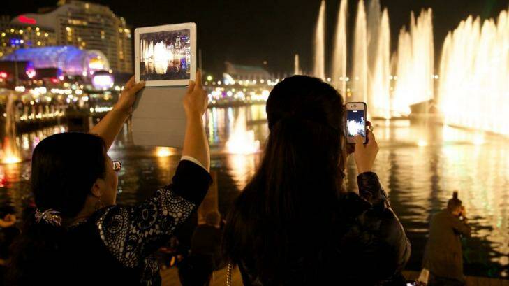 Audience members watch Vivid Aquatique Water Theatre at Darling Harbour on the night Mr Hickey drowned. Photo: Wolter Peeters