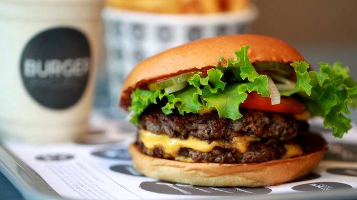 A burger from Neil Perry's Burger Project. Photo: Edwina Pickles