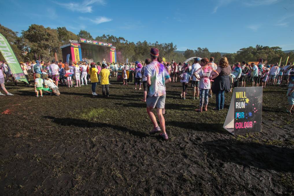 A field of 6000 competitors turned Stuart Park into a muddy bog for the Color Run in Wollongong last Sunday.Picture: ADAM McLEAN