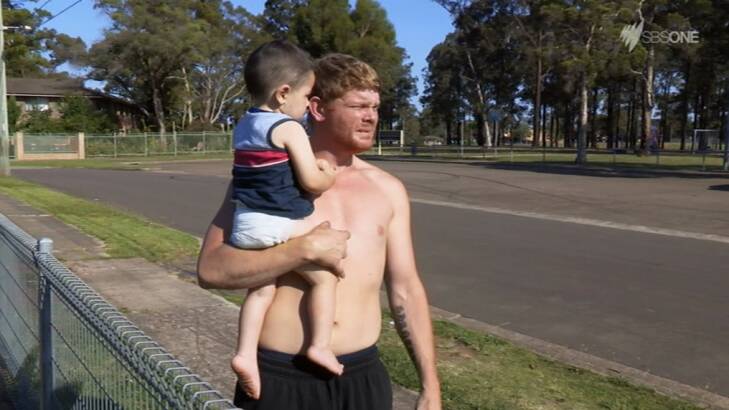 Ice addict Corey holds his son Liam in the final episode of <em>Struggle Street</em>. Photo: SBS
