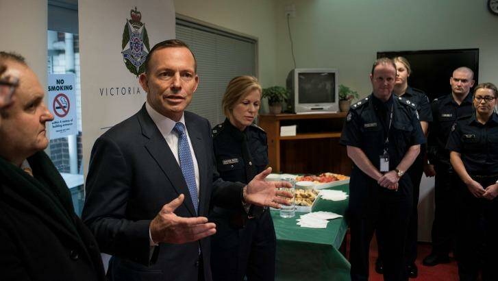 Former prime minister Tony Abbott discusses counter terrorism with Victoria Police and the AFP at Endeavour Hills Police Station in Melbourne in June. Photo: Josh Robenstone