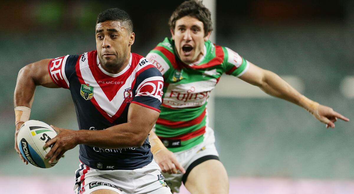Michael Jennings goes past Joel Reddy of the Rabbitohs to score a try for the Roosters during the NRL match at Allianz Stadium on Friday night. Picture: GETTY IMAGES