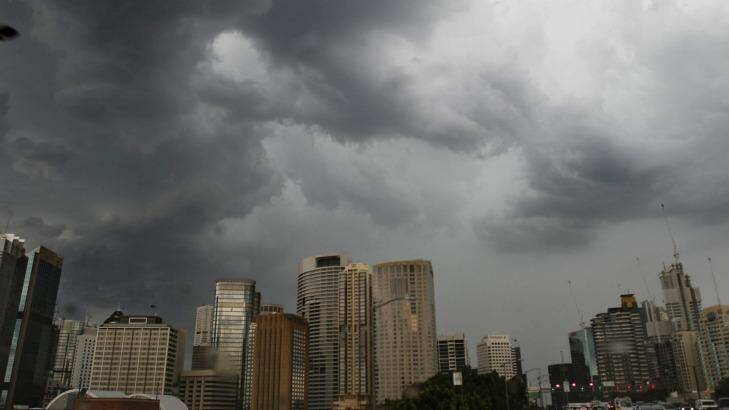 Storm clouds gather above the Sydney CBD. Photo: Quentin Jones