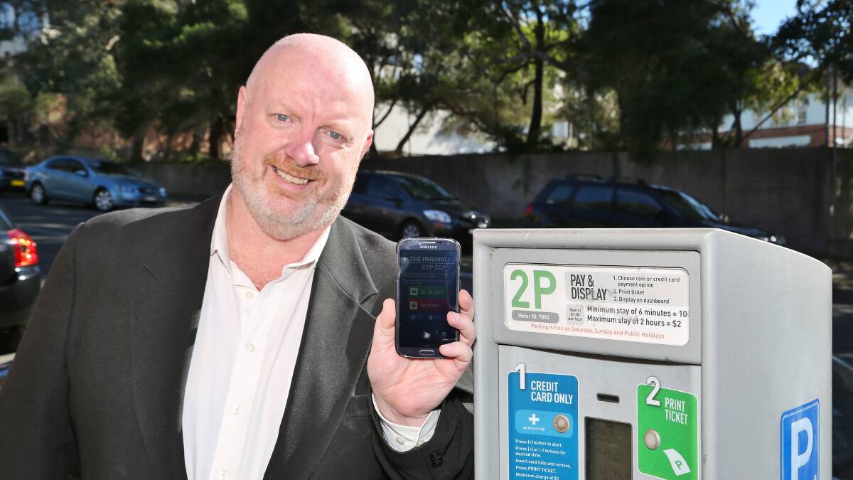 Greg Dodd with his parking police app. Pictures: GREG ELLIS