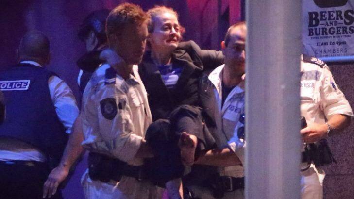 Marcia Mikhael is rescued from the Lindt cafe in Martin Place in Sydney. She is reportedly receiving $400,000 for a media interview. Photo: Andrew Meares