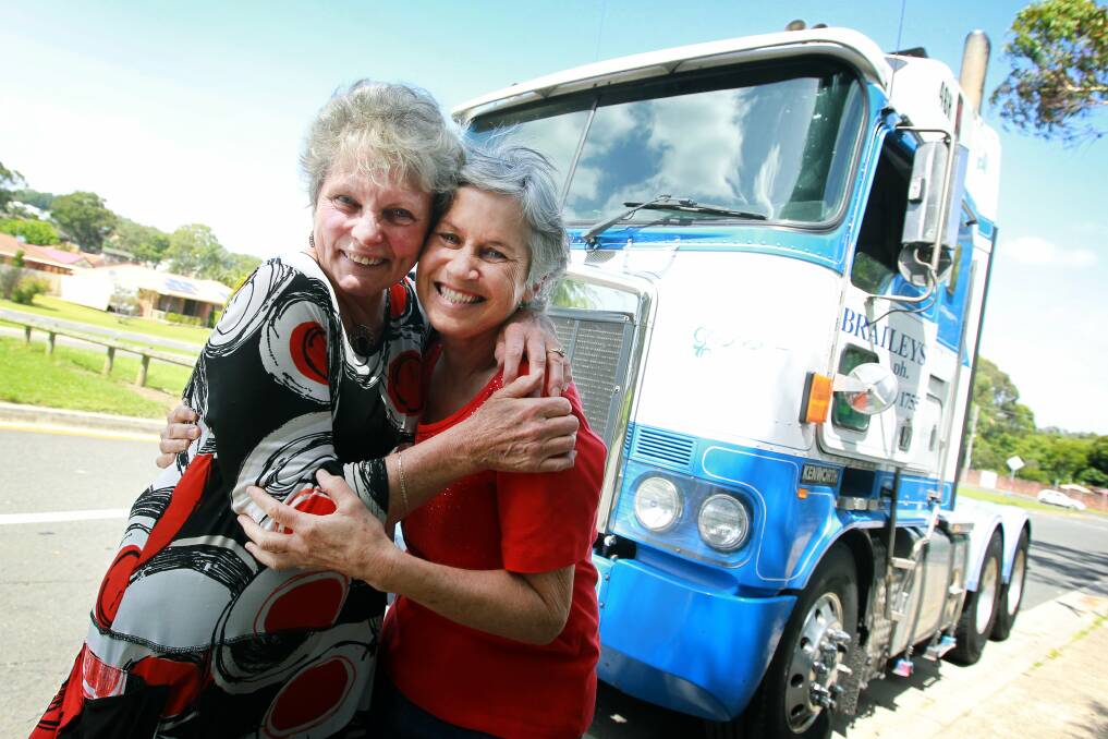 Long-serving teachers Julie Faddy and Pat Boniface hug each other in front of the truck they took a ride in. Picture: SYLVIA LIBER