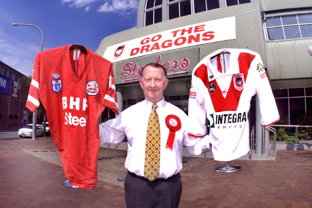 Steelers boss Bob Millward holding a Steelers shirt from the past and a current Dragons shirt. Picture: ORLANDO CHIODO