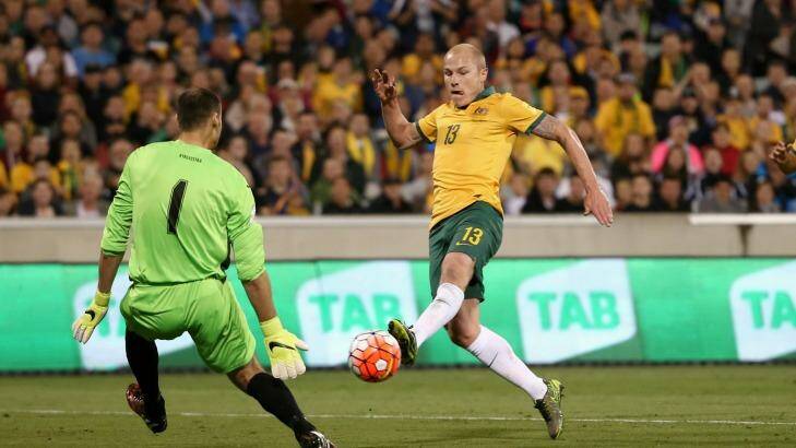 In demand: Aaron Mooy playing against Kyrgyzstan. Photo: Alex Ellinghausen
