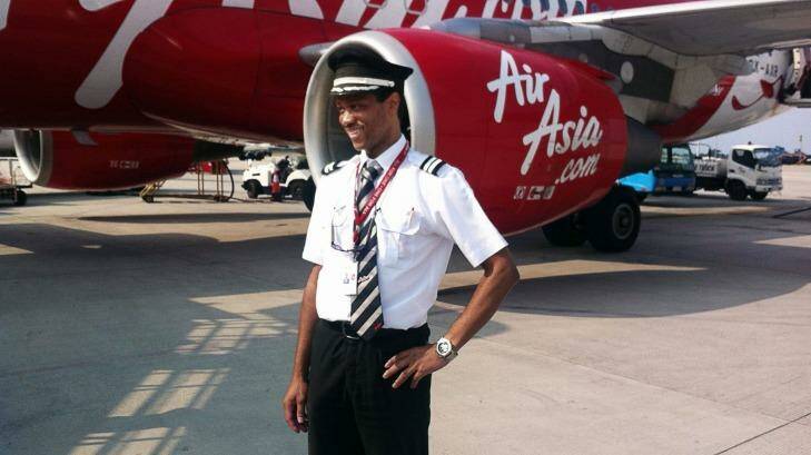 First officer: Co-pilot of the ill-fated AirAsia flight QZ8501 Remi Emmanuel Plesel, who is from the French island of Martinique, posing in front of an Air Asia aircraft. Photo: Courtesy of the Plesel family