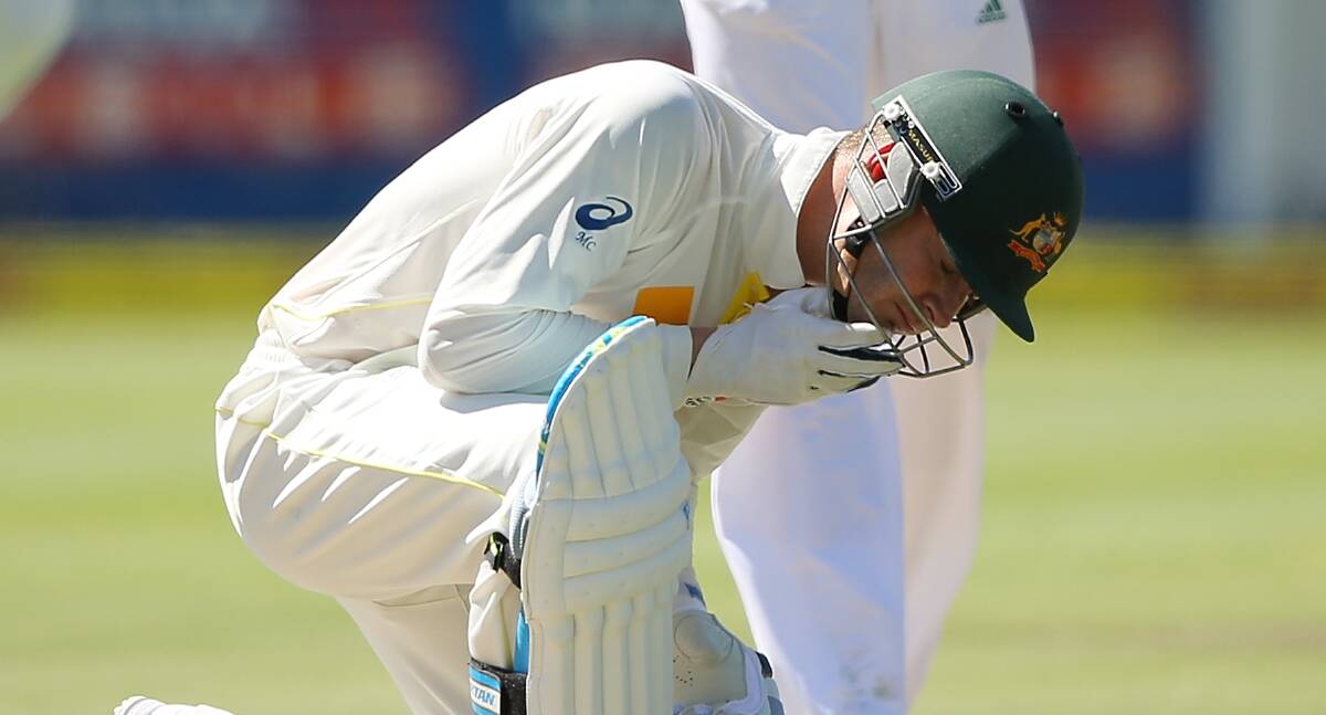 Michael Clarke feels the pain during the Third Test against South Africa at Newlands in March. Picture: GETTY IMAGES