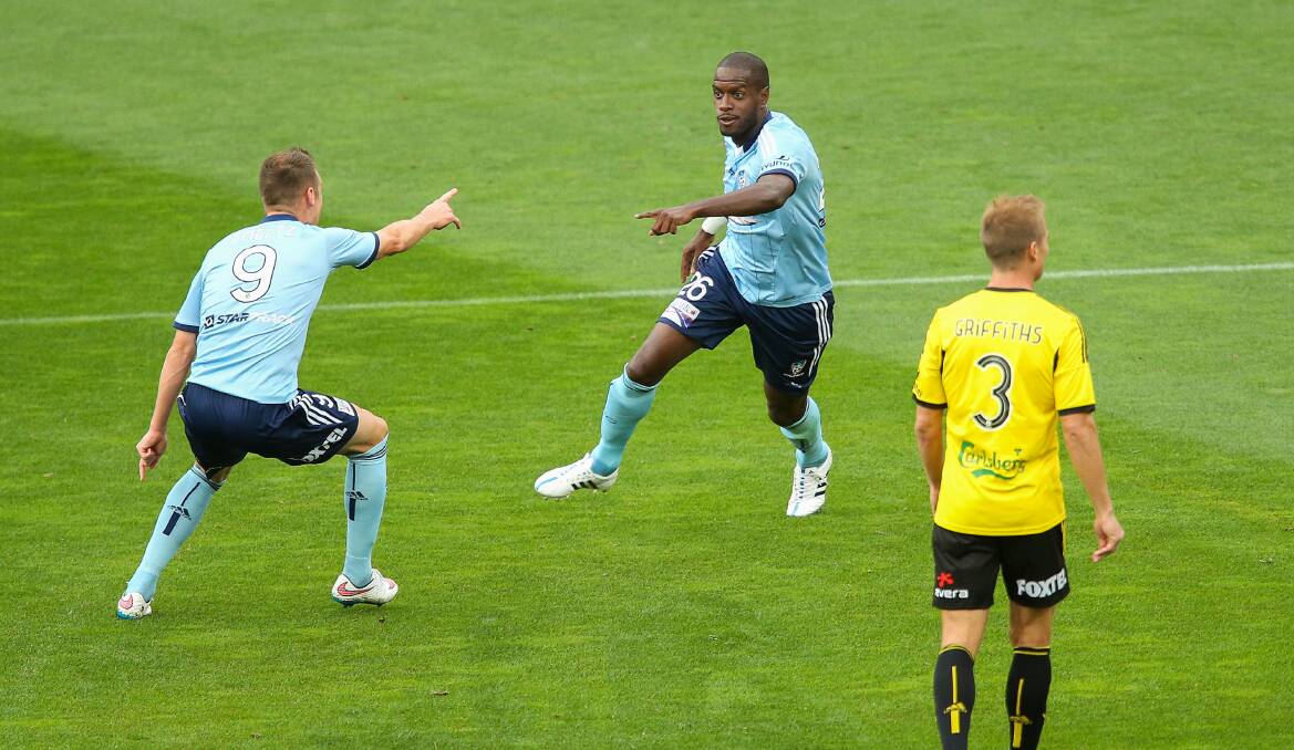Sydney FC's Jacques Faty, centre, celebrates with Shane Smeltz after scoring. Picture: GETTY IMAGES