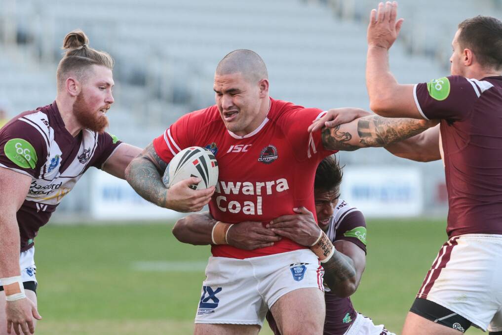 Cutters' Russell Packer barges his way past three Manly players during his side's convincing win. Picture: ADAM McLEAN