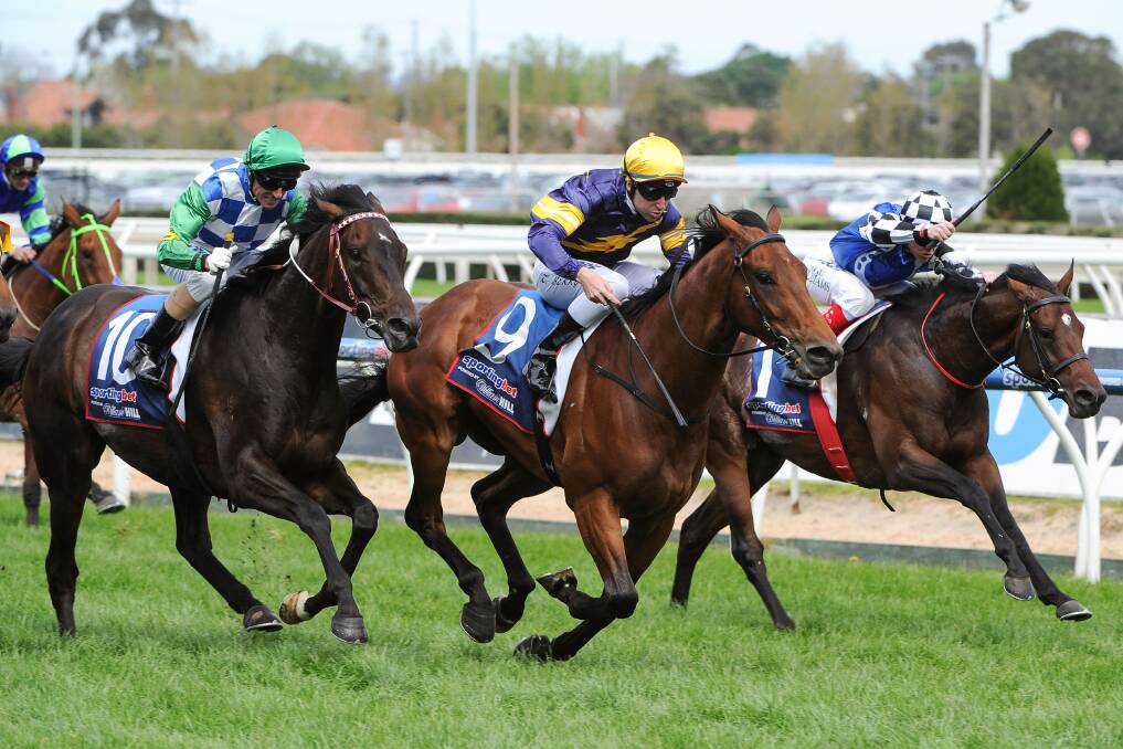 Tommy Berry on Big Memory, centre, takes the Herbert Power Stakes at Caulfield. Picture: GETTY IMAGES